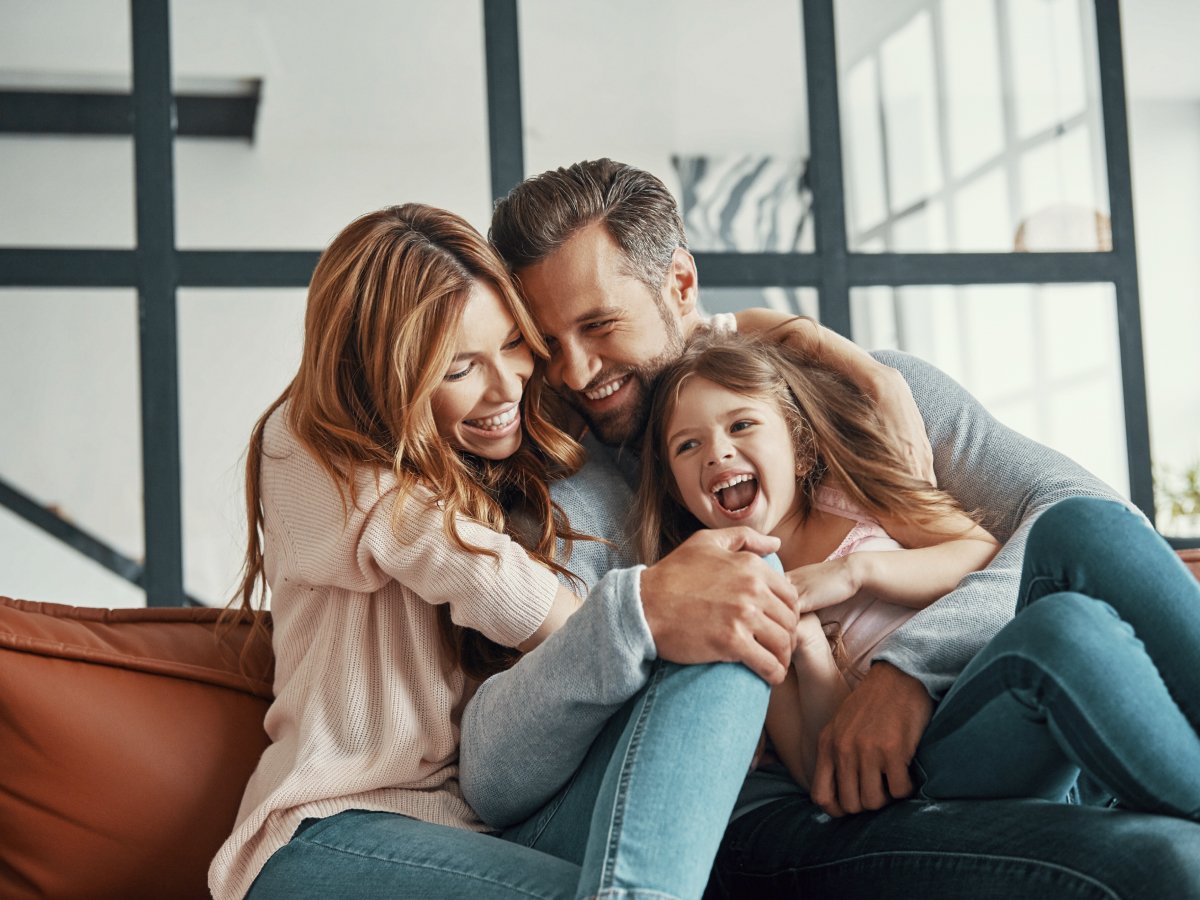 Family hugging and laughing