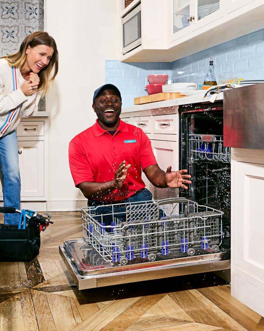 Woman looking at washing machine in surprise