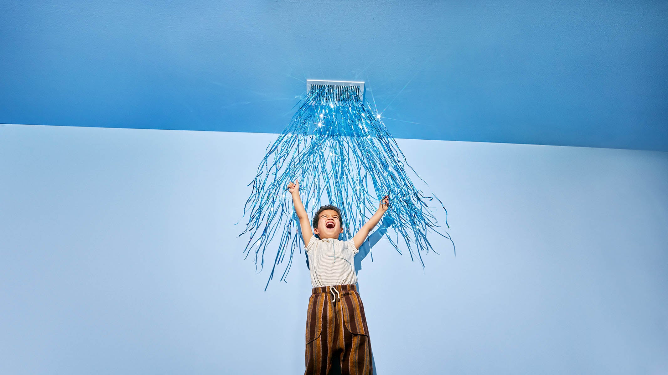 Child under fan