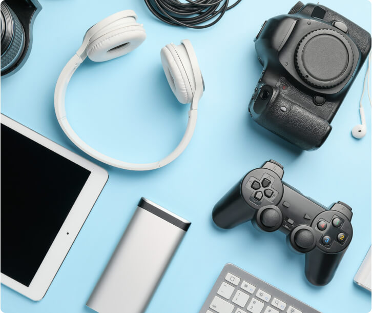 Various electronic devices on a blue table