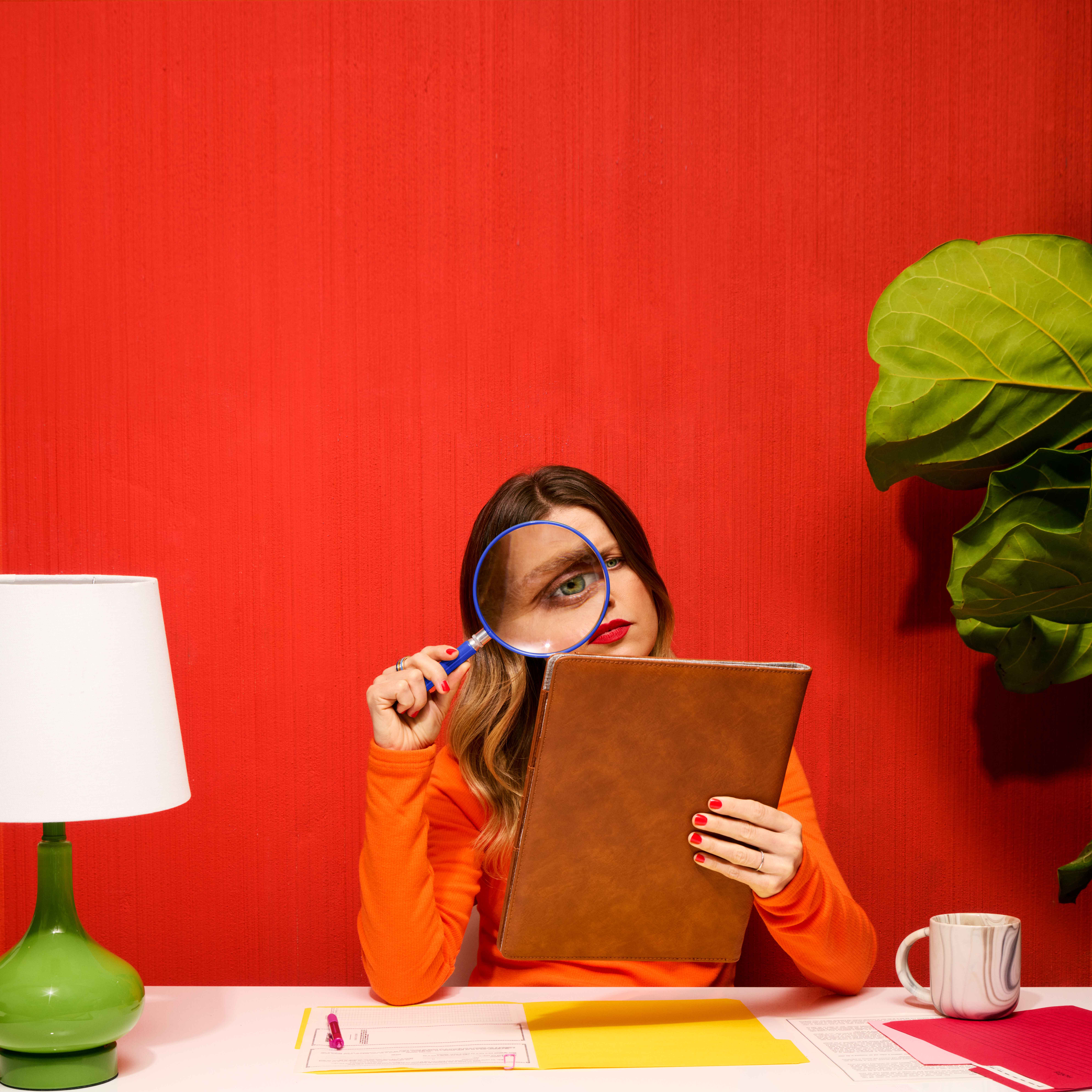 Women using magnifying glass