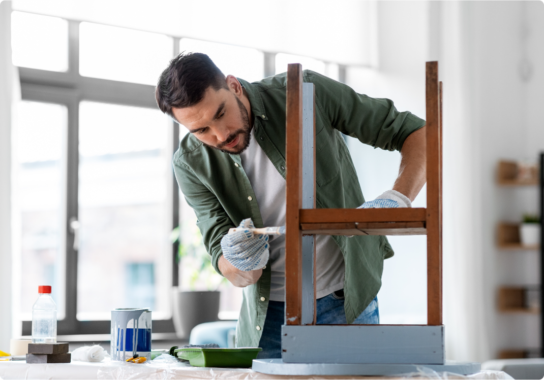 man painting table