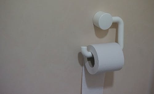 Toilet paper hanging on the wall