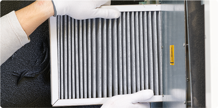 Someone replacing an HVAC filter