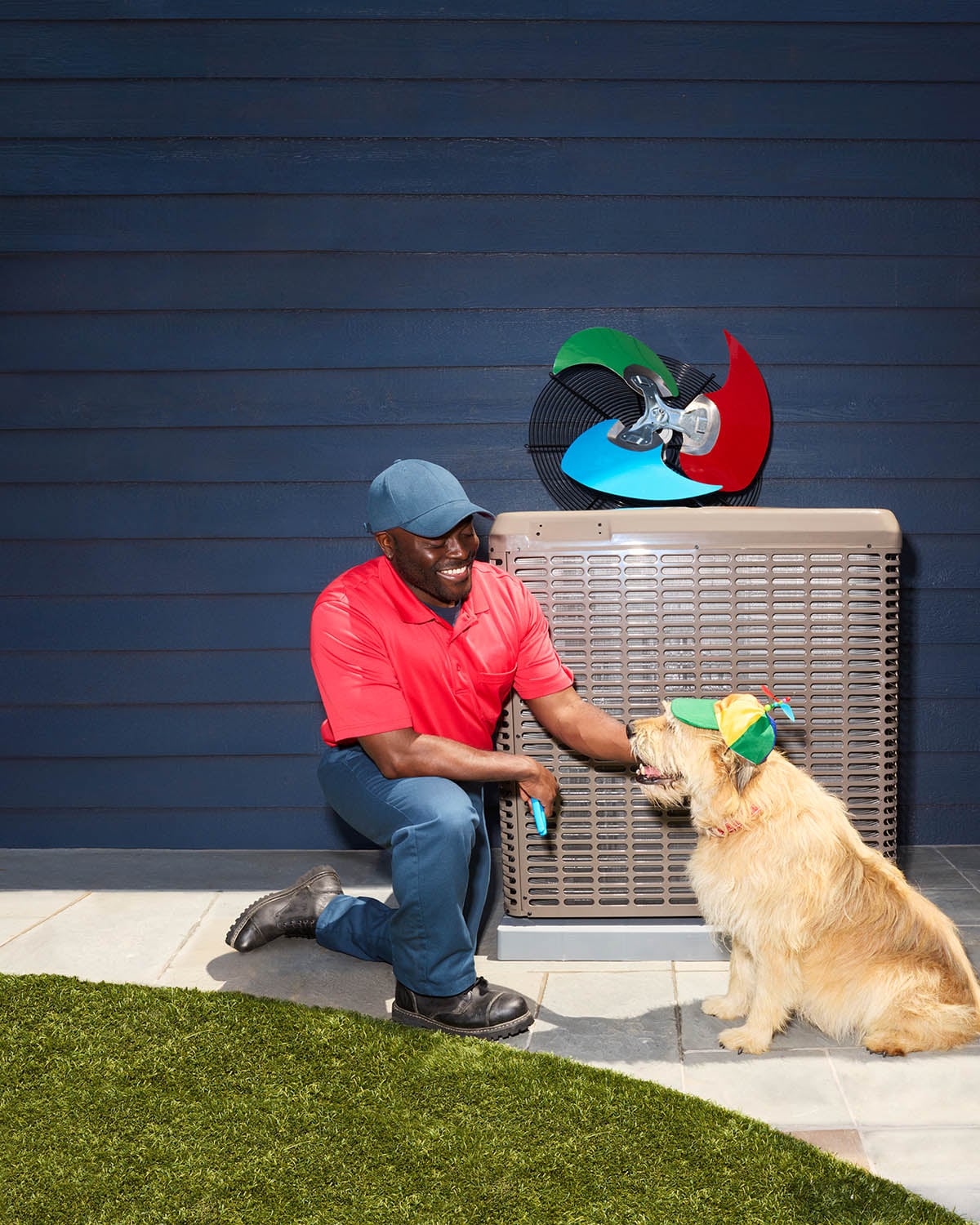 AHS Brand tech with dog in front of air conditioner