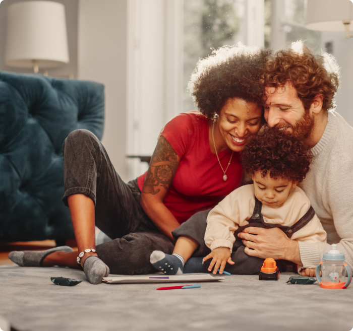 Mother and father playing with a child