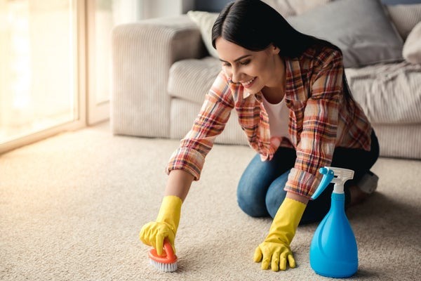 woman cleaning carpet