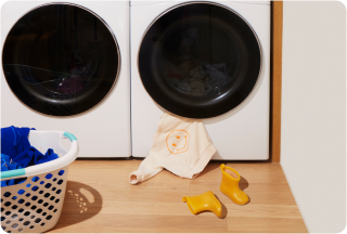 Clothes on the floor by washer