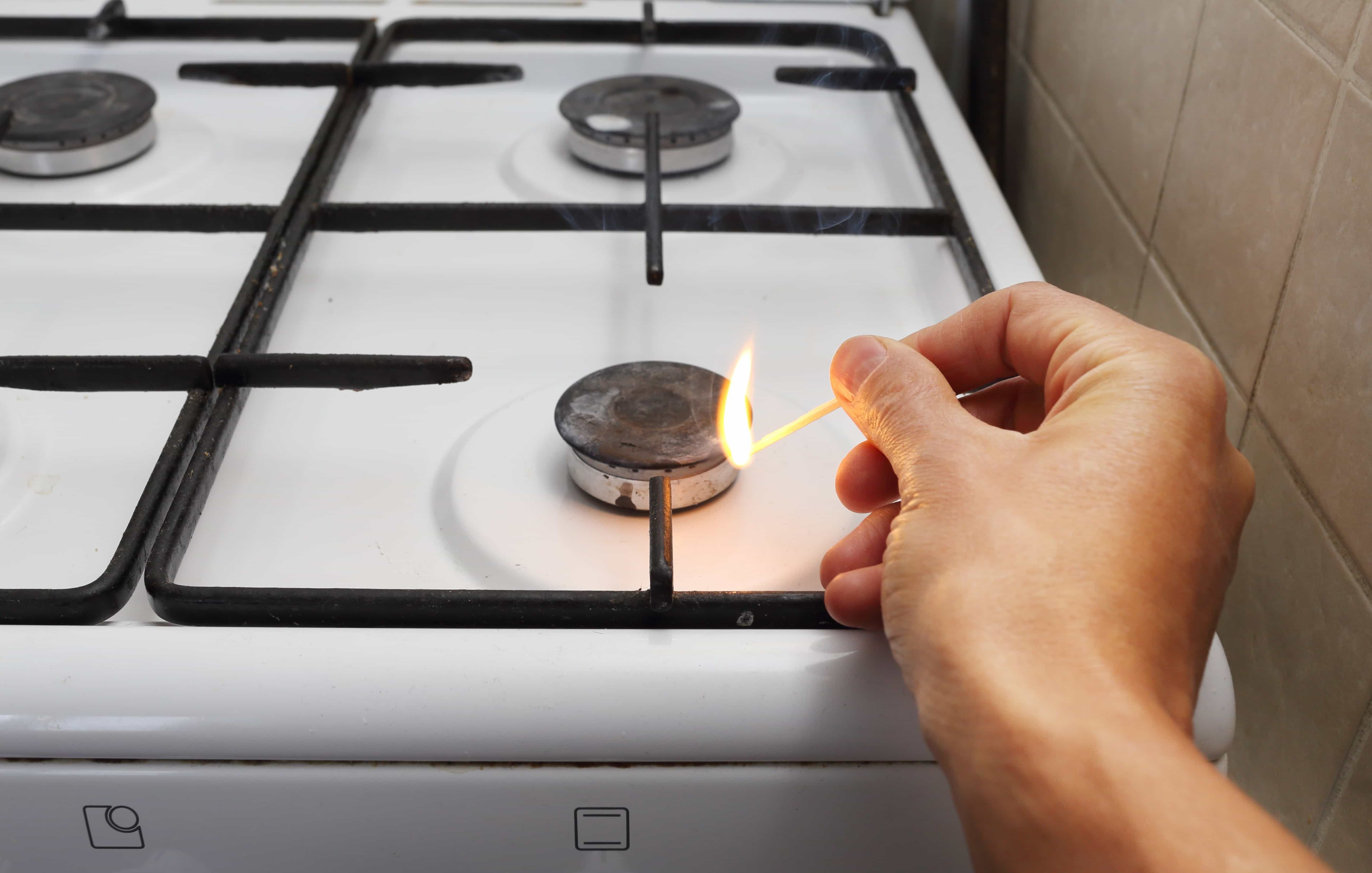 lighting gas stove with a match