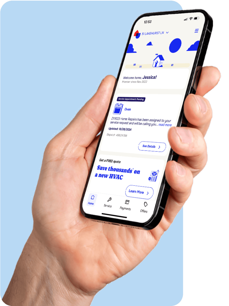 Hand holding a phone displaying the AHS mobile application