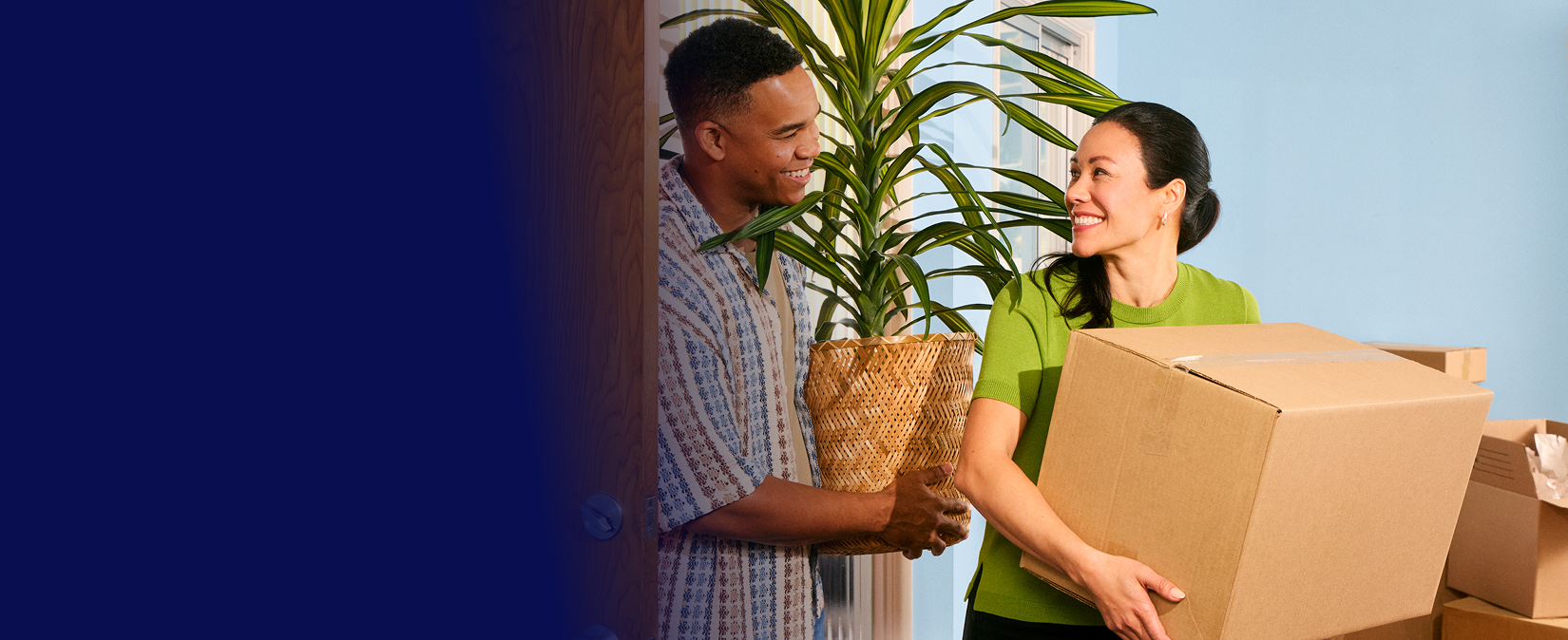 Couple taking a break from unpacking boxes in their new home