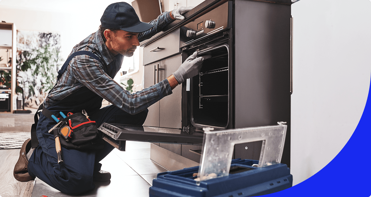 Technician performing oven maintenance