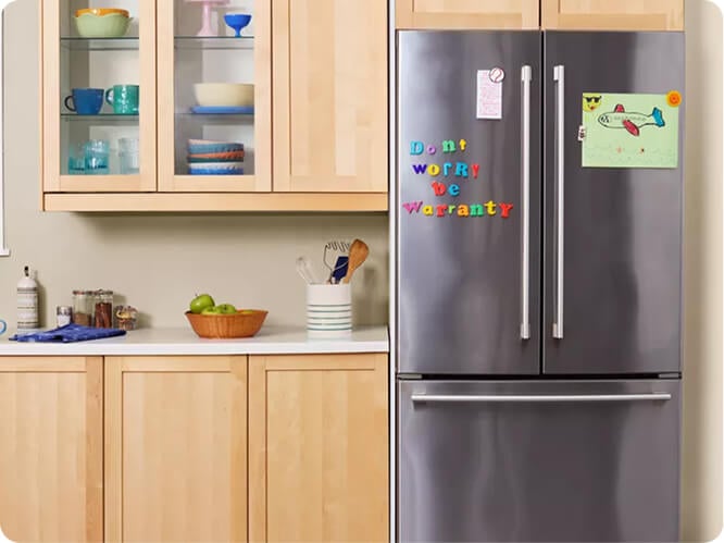 Refridgerator with the words 'Don't worry be warranty' on the front door